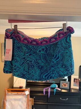 Lilly Pulitzer NWT Calah Skirted swim bottom in ocean motion.